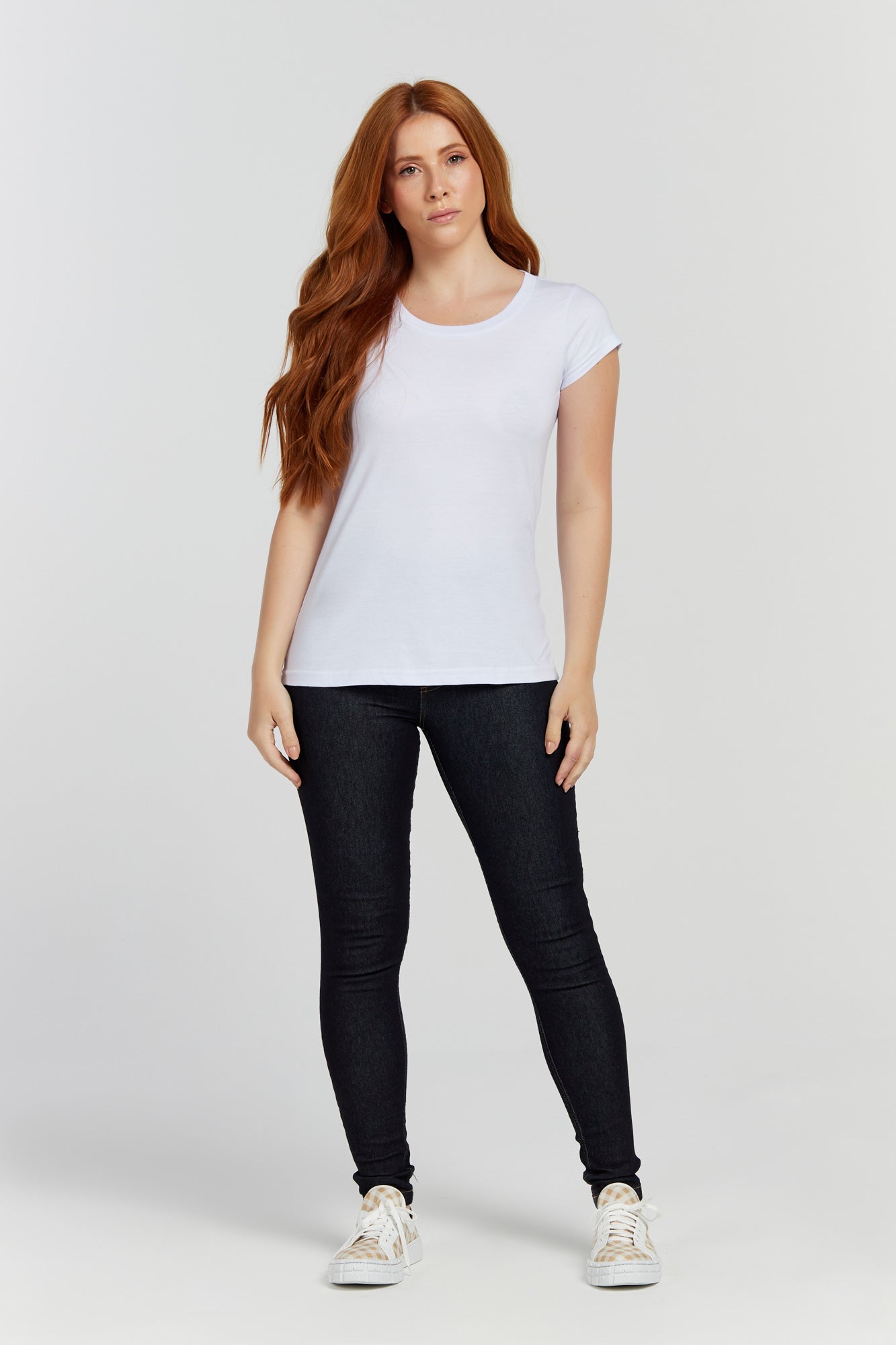 Premium Photo  A model wears a white t - shirt and black leggings